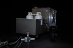 Southern Pride MLR-150 Mobile trailer-mounted gas rotisserie smoker, three-quarter view on the trailer