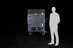 Southern Pride MLR-150 commercial gas rotisserie smoker, shown to scale beside a person