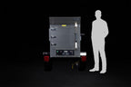 Southern Pride MLR-150 Mobile trailer-mounted gas rotisserie smoker shown to scale beside a person
