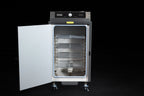 Southern Pride SC-100 commercial electric smoker, with the door open showing the product racks