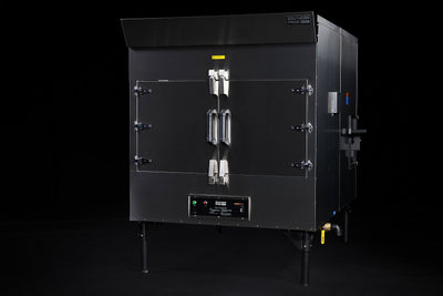 Southern Pride SP-700 commercial gas rotisserie smoker, front three-quarter view on legs