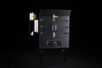 Southern Pride SPX-300 commercial gas rotisserie smoker, angled view showing firebox side and control panel