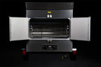 Southern Pride SP-700 Mobile trailer-mounted gas rotisserie smoker, doors open showing the rotisserie racks