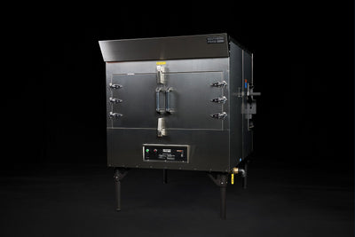 Southern Pride SPK-500 commercial gas rotisserie smoker, front three-quarter view on legs