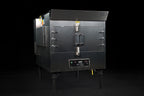 Southern Pride SPK-500 commercial gas rotisserie smoker, angled view showing firebox side and control panel
