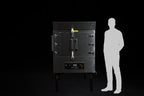 Southern Pride SPX-300 commercial gas rotisserie smoker shown to scale beside a person