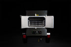 Southern Pride SPX-300 Mobile trailer-mounted gas rotisserie smoker, doors open showing the rotisserie racks
