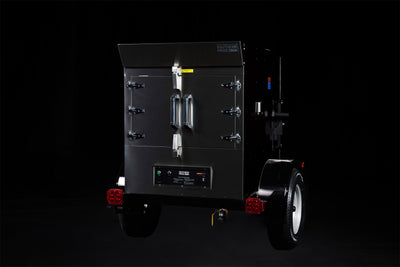 Southern Pride SPX-300 Mobile trailer-mounted gas rotisserie smoker, left side view on the trailer