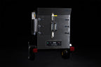 Southern Pride SPX-300 Mobile trailer-mounted gas rotisserie smoker, right side view on the trailer